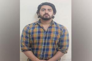 Delhi violence: Man who pointed gun at unarmed cop arrested from UP