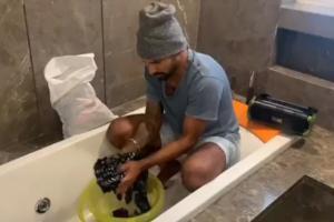 Dhawan washes clothes, cleans washroom while wife Ayesha does make-up