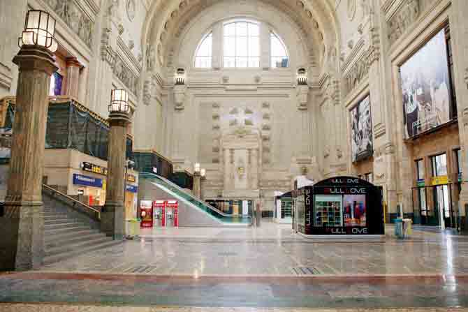 The usually bustling Stazione Centrale, the main railway station of  Milan, wears a deserted look