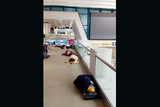 Students stranded in Italy seen sleeping at an airport
