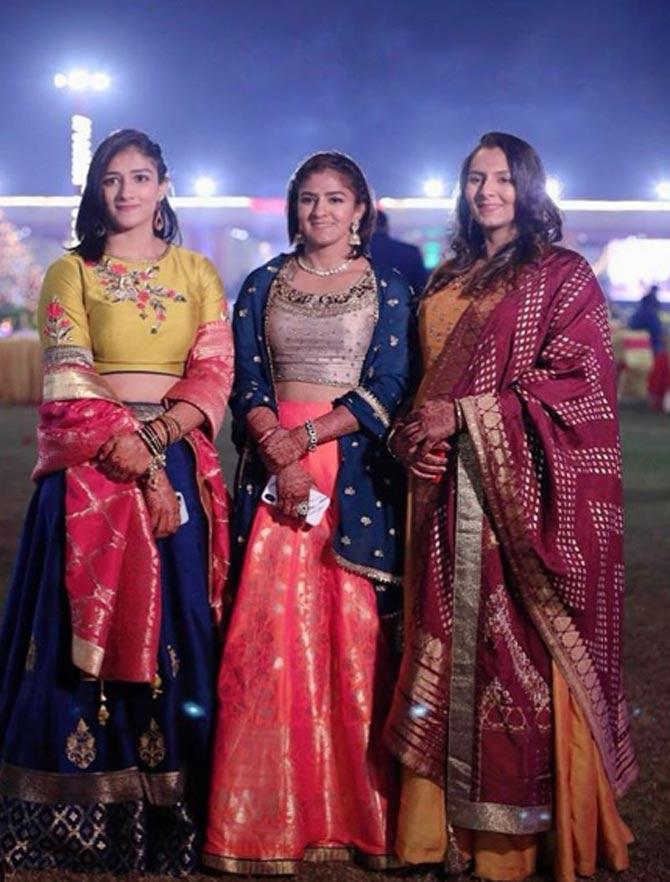 The Phogat sisters' success sent waves across the media in the country following their fight with gender inequality and child marriage in order to pursue their respective careers.
In picture: Ritu, Geeta and Sangita at Babita's wedding reception.