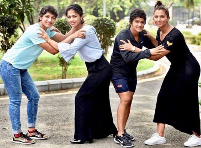 Ritu Phogat posted this photo with her sisters and wrote: To us, family means putting your arms around each other and being there.