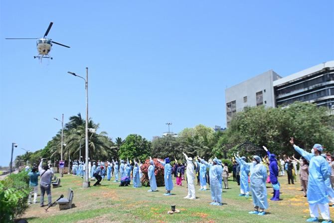 In a bid to honour frontline workers including doctors, medical professional, police officials and paramilitary forces, the Indian Air Force choppers on Sunday showered flower petals on all frontline workers and hospitals, who are leading India's fight against the COVID-19 crisis.