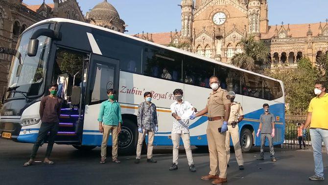 In picture: A bus to transport migrant workers stands neat CST station in South Mumbai