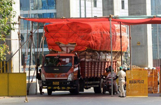 In picture: A goods truck arrives at police check post shelter at Samta Nagar police station in Kandivli amid nationwide lockdown.