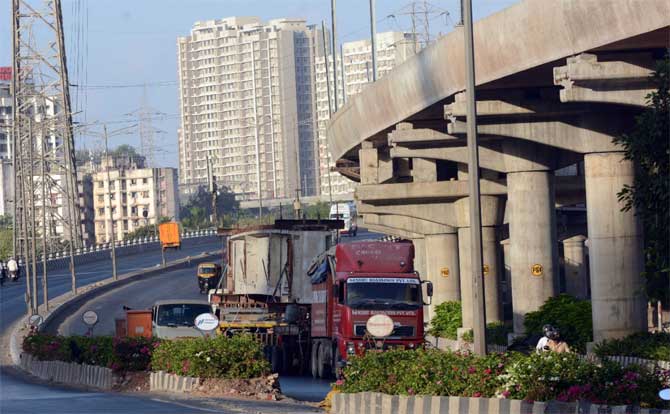 As per the order, seven additional commissioners will work towards improving the double rate of positive cases from 10 days to 20 days by May 17.
In picture: A puller truck carries a pillar which is to be attached on the under-construction Metro line near the Saidham temple at the Western Express Highway in Kandivali.