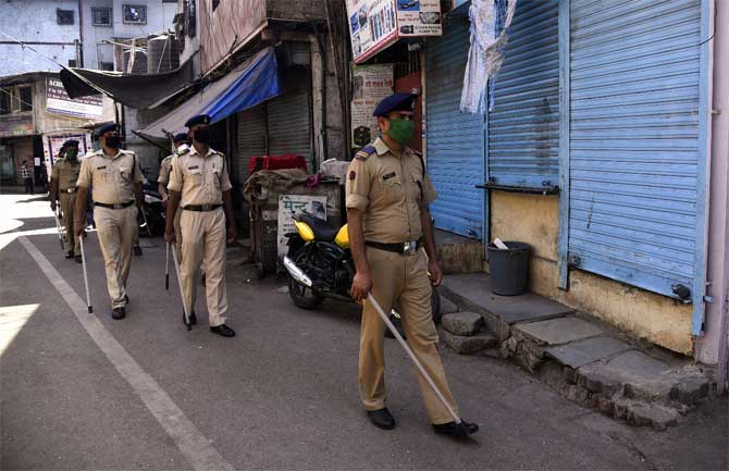 Dharavi alone now has 833 positive cases. Five other cases were reported from Mahim, 18 in Dadar, including eight cases from Kasarwadi. 
In picture: Officers of the State Reserve Police Force (SRPF) at a slum in Dharavi. 