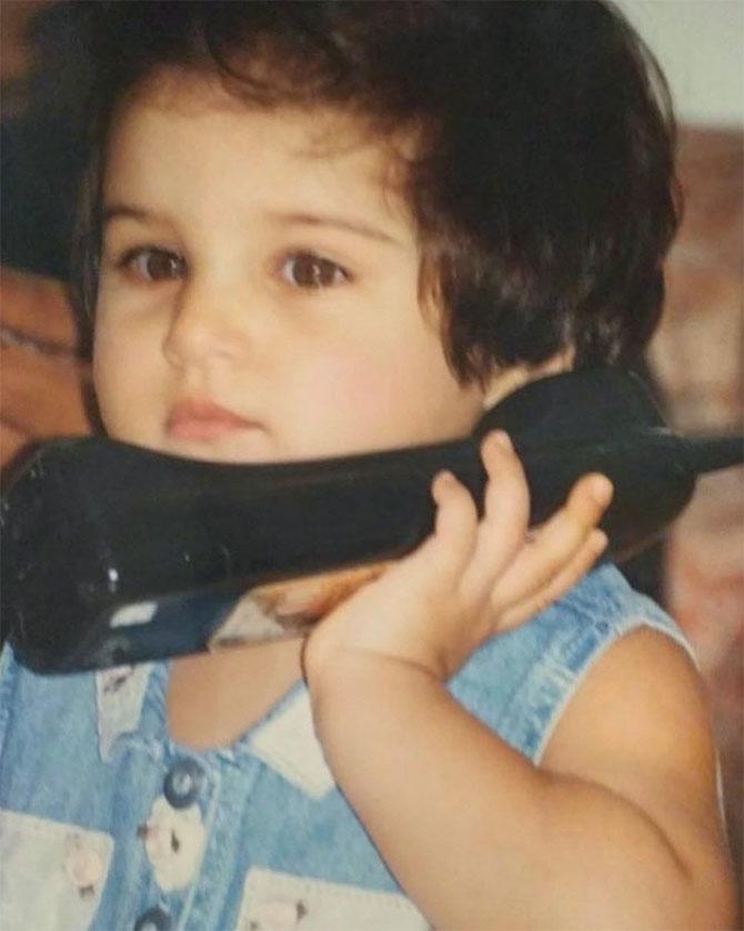 Tara Sutaria also shared a cute childhood photo of her holding on to a cordless phone. She captioned the image 