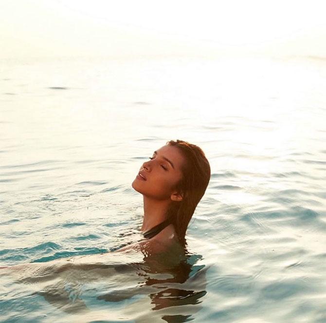 Tara Sutaria shared this photo of her in the sea from a photoshoot and wrote, 