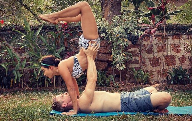 Aashka Goradia Goble and husband Brent Globe also share a lot of posts on them doing couples Yoga. Aashka shared a series of photos of them and wrote, 
