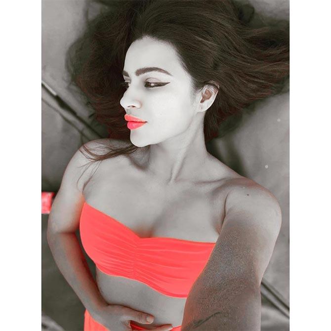 Aashka Goradia shared this selfie of her in an orange halter top and captioned it: 