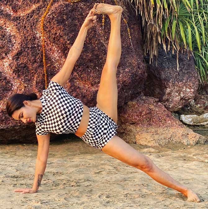 Aashka Goradia shared this photo of her in a checkered two-piece and wrote, 