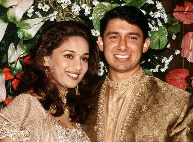 Bollywood's dhak-dhak girl broke many hearts when news of her wedding surfaced. She tied the knot with Dr Shriram Nene, a cardiovascular surgeon, in a private ceremony in Los Angeles, California, on October 17, 1999.
In picture: Madhuri Dixit with her doctor husband Shriram Nene at their wedding reception on December 18, 1999, with select guest from the city's glitterati in attendance in Bombay.