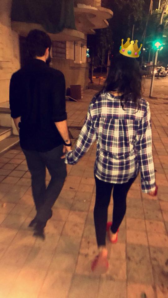 In photo: Mitali Borude and Amit Thackeray hold hands as they walk on the streets of Dadar in Mumbai.
