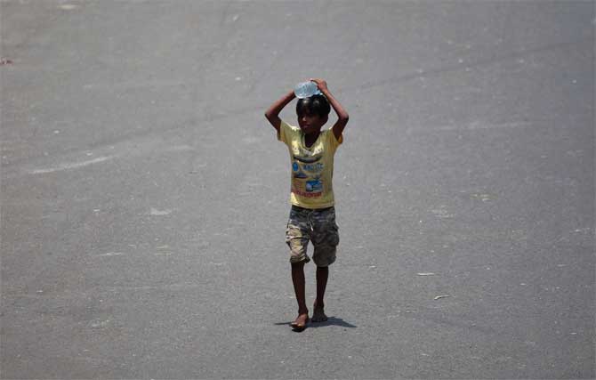 Meanwhile, Finance Minister Nirmala Sitharaman on Friday said that the Centre will launch a Rs 10,000 crore scheme for formalisation of micro food enterprises
In picture: A young boy walks on the road with a bottle of water  in the scorching sun in Dadar.