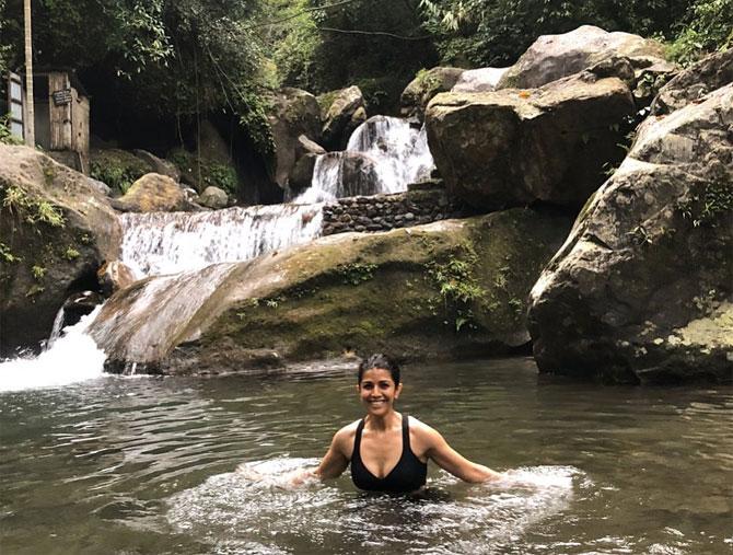 On the Earth Day, Nimrat shared this photo of her taking a dip in a pond in the 'middle of nowhere'! She captioned the image, 