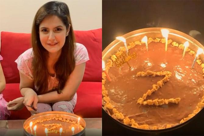 Zareen Khan celebrated her birthday amid the lockdown at home with her family. She shared boomerang videos of her cutting the cake. Some glimpses of my Birthday celebrations P.S. The cake is a no bake cake made of biscuits, chocolate & some walnuts , by my darling lil sister and I must say it's the yummiest cake I've eaten till date. Thank you Sana (my Laddu) #HappyBirthdayToMe #QuarantineBirthday2020 [sic]