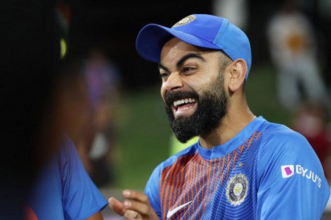 Captain Giggle: Indian captain Virat Kohli celebrates after winning the fifth Twenty20 cricket match between New Zealand and India at the Bay Oval in Mount Maunganui on February 2, 2020.