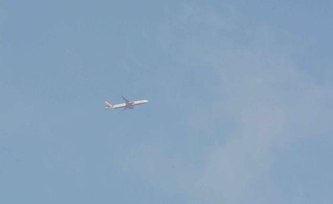 In photo: An Air India flight was spotted flying over the skyline of Mumbai amid lockdown across the country.