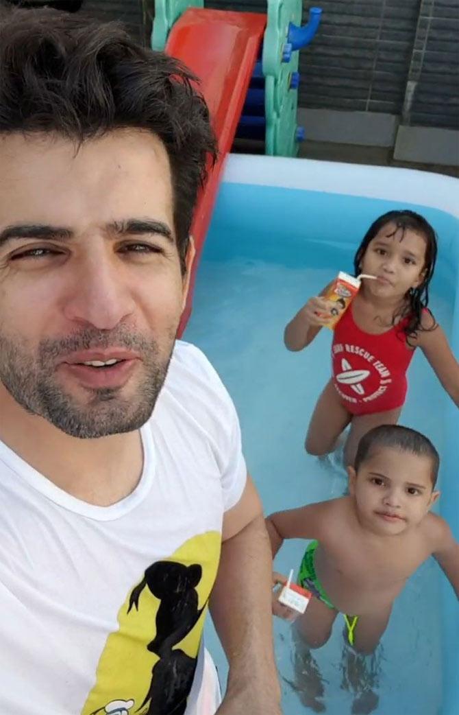In this one, the little kids were seen chilling in the baby pool at their home. Jay Bhanushali shared a video, which read, 