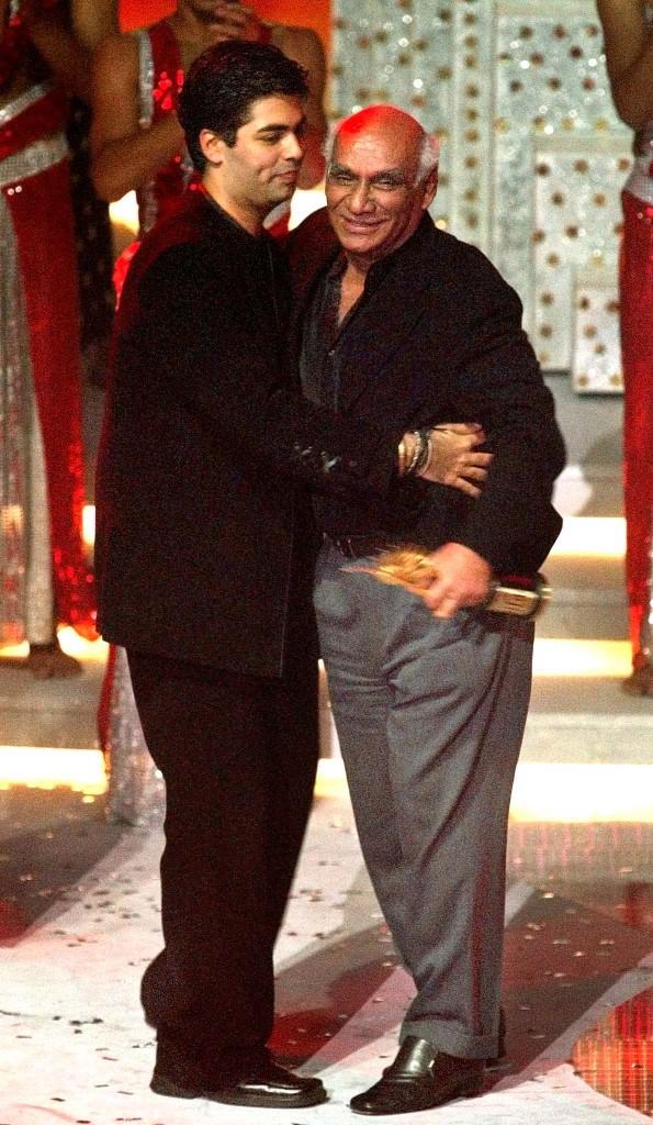 Yash Chopra is congratulated by film director Karan Johar after the former received the Invaluable Contribution to Indian Cinema Award at the International Indian Film Academy (IIFA) awards ceremony in Genting Highlands, Malaysia on April 6, 2002.