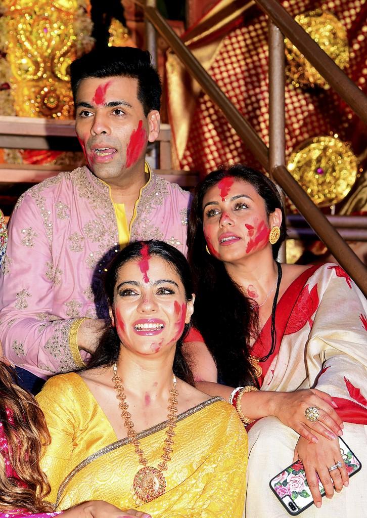 A look at some more candid photos of KJo:
Kajol, Karan Johar and Rani Mukerji look on after applying vermillion powder during the traditional ritual of Sindoor Khela on the last day of the 'North Bombay Sarbojanin Durga Puja' festival in Mumbai on October 8, 2019.