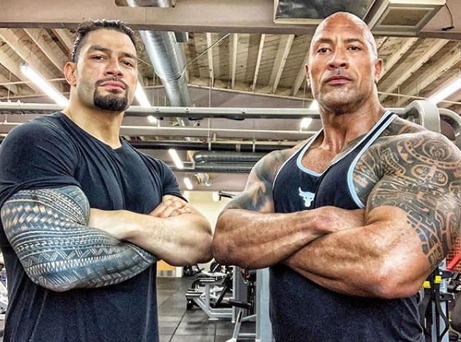 Roman Reigns is a four-time WWE World Champion. Reigns won the WWE title three times and the Universal title once.
In picture: Roman Reigns with Dwayne 'The Rock' Johnson