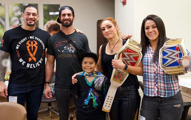 Roman Reigns has mentioned Bret 'Hitman' Hart as his idol in WWE wrestling.
In picture: Roman Reigns with Seth Rollins, Becky Lynch and Bayley