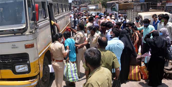 The Maharashtra government has come up with new guidelines, following those of the Ministry of Health and Family Welfare. As per these guidelines, issued on May 24, international travellers will have to stay for only seven days in paid hotel quarantine and can spend the remaining seven days of the 14-day period at their homes
In picture: Cops help migrant workers board a bus that would ply them to the CSMT Station to board the Shramik special train. 