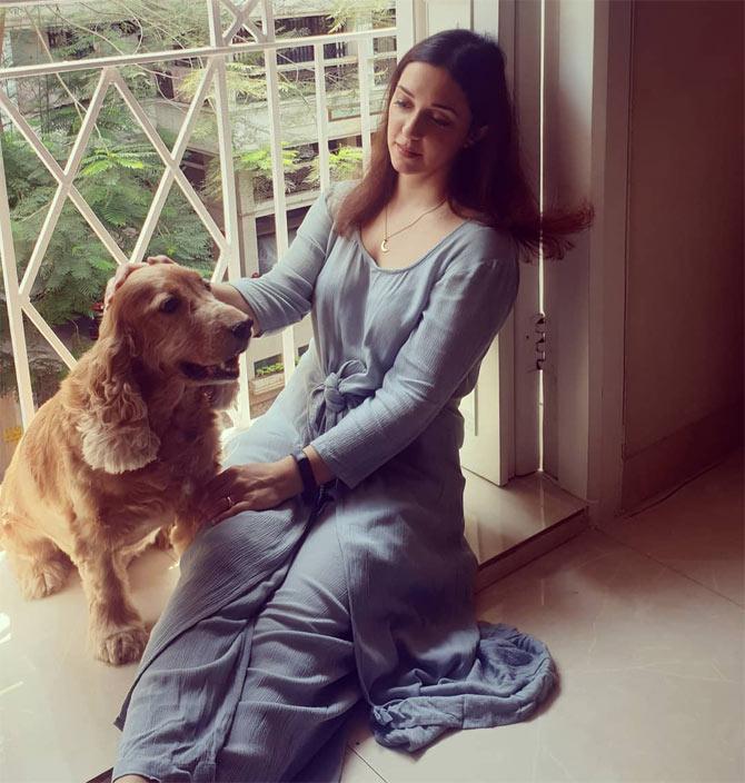 This one, of her chilling with her pet, is all we need right now! 