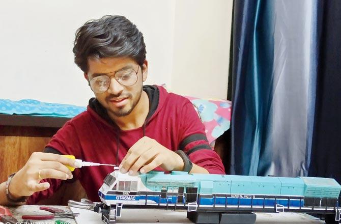 To acquire the weather beaten look of a diesel locomotive, Kamble uses candle light against the aluminium sheets