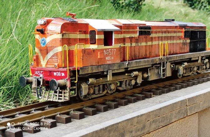 To acquire the weather beaten look of a diesel locomotive, Kamble uses candle light against the aluminium sheets