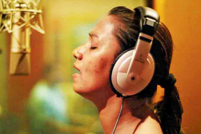 Playback singer Kalpana Patowary in a still from Bidesia in Bambai, Surabhi Sharma’s documentary on the bond Bhojpuri music forms between migrants and their North Indian hometowns. PIC COURTESY/SURABHI SHARMA