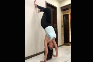 Karishma Tanna pulls of inverted yoga pose with injured foot