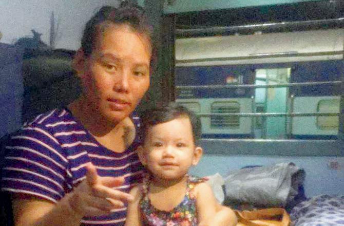 Ibemcha Samurailatpam with her daughter Sara on the delayed Manipur-bound