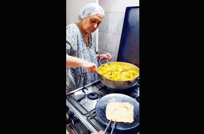 Rita Malik, 70, spends her mornings cooking kadhi chawal, aloo puri or bread pakodas, that will then make the rounds of construction sites around GK 1 South Block where migrant workers are stuck