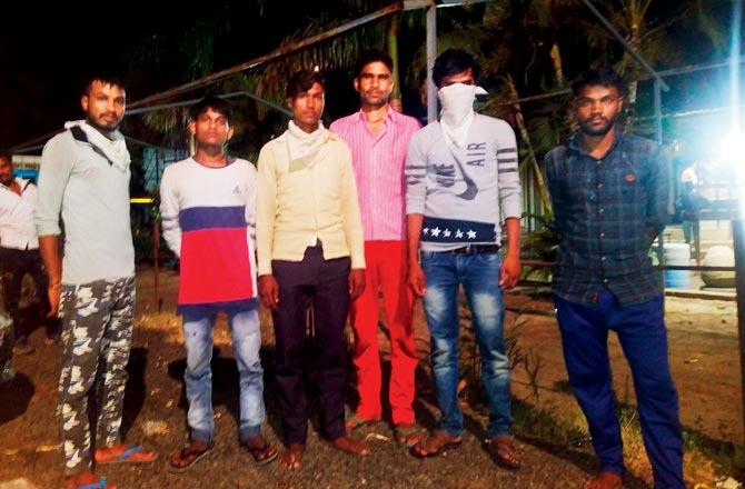 Lalit Kumar (in pink shirt) with his friends. They were working in Valsad, Gujarat, in textile mills. Pic/Ranjeet Jadhav