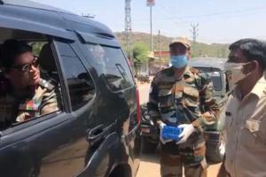 Viral video shows army officer lauding cops, distributing sweets