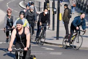 Britishers cycle to work as lockdown eases