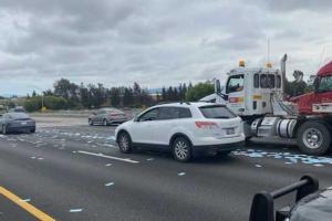 COVID-19: Drivers stop to pick up spilled face masks, cause traffic jam