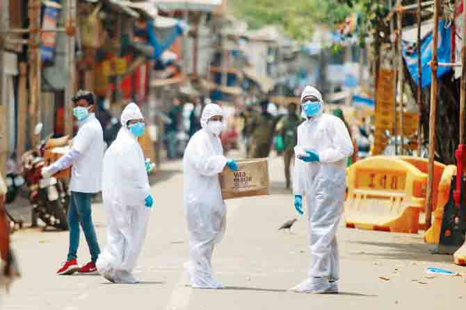 Doctors wearing PPE suits prepare to enter Jijamata Nagar, a containment zone in Worli. PIC/ASHISH RAJE