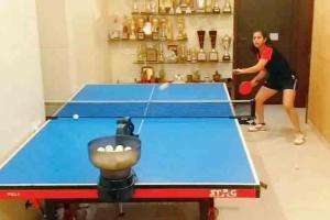 Junior National table tennis champion Diya Chitale trains with a robot