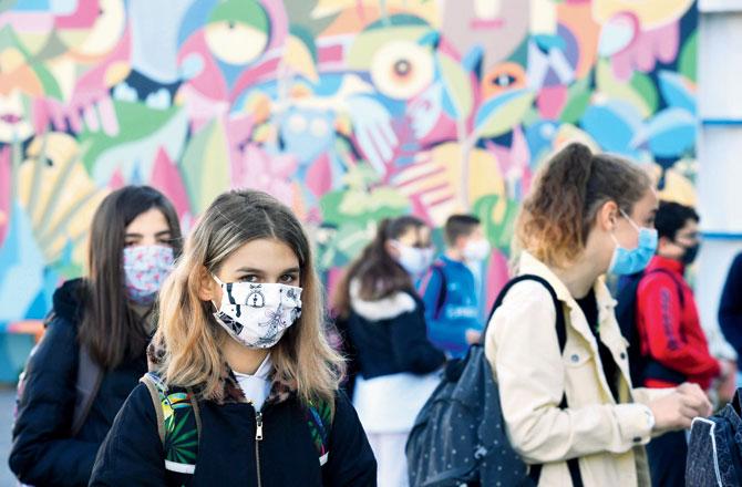 Schoolchildren wearing face masks enter Claude Debussy college in Angers, France, as countries ease lockdown measures to curb the spread of the COVID-19 pandemic. Pics/AFP