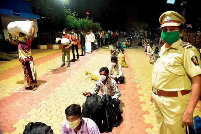Migrants wait to board a train at Panvel station on Wednesday. PIC/Sameer Markande