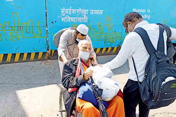 Srinivasan Swamy, 81, was helped by a passenger and his assistant after his wheelchair got stuck