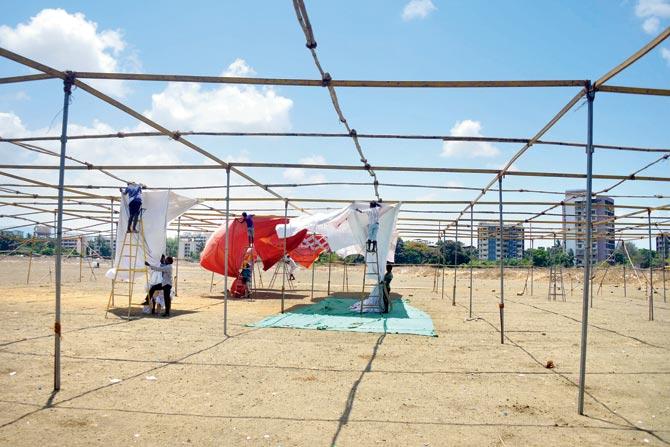 Workers dismantle the tents at Suncity ground