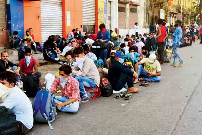 Migrants from Dharavi wait in Wadi Bandar to board a Shramik Special from CSMT. PIC/SURESH KARKERA