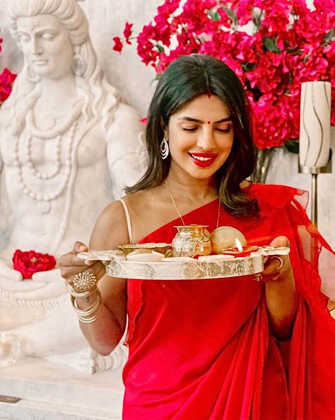 For Priyanka Chopra Jonas, who married singer Nick Jonas in 2018, it was her second Karva Chauth. PC too celebrated the festival in California. She took to Instagram to share two pictures from her Karva Chauth celebrations from her US home with the 'Sucker' singer. In the photos, Priyanka looked stunning in a simple red sari paired with a golden blouse. The former Miss World finished off her look with drop earrings, sindoor and a bindi.