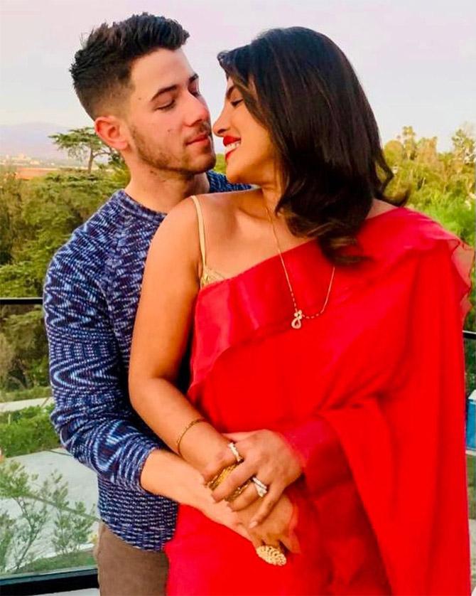 In another picture, Priyanka Chopra can be seen curled up in her husband's arms. 