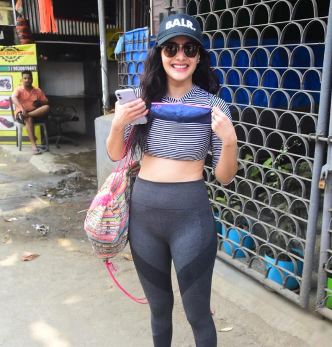 Amrya Dastur raised the city's temperature as she was clicked by the photographers in her charming best in Bandra, Mumbai. She opted for a grey checkered crop top and trousers for the outing.